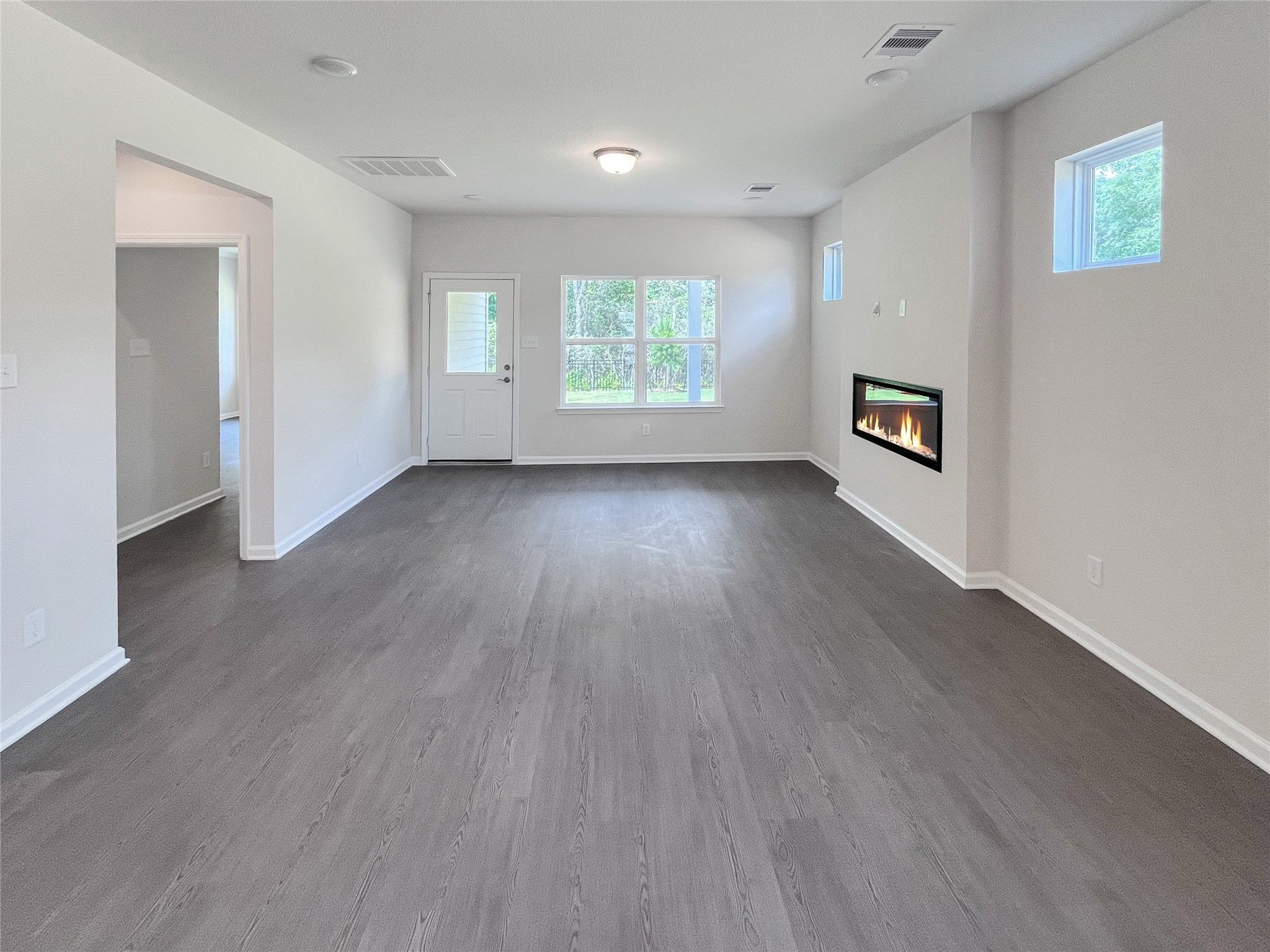 The Robin II- Family Room with Linear Electric Fireplace. Sample image to be used for example only.