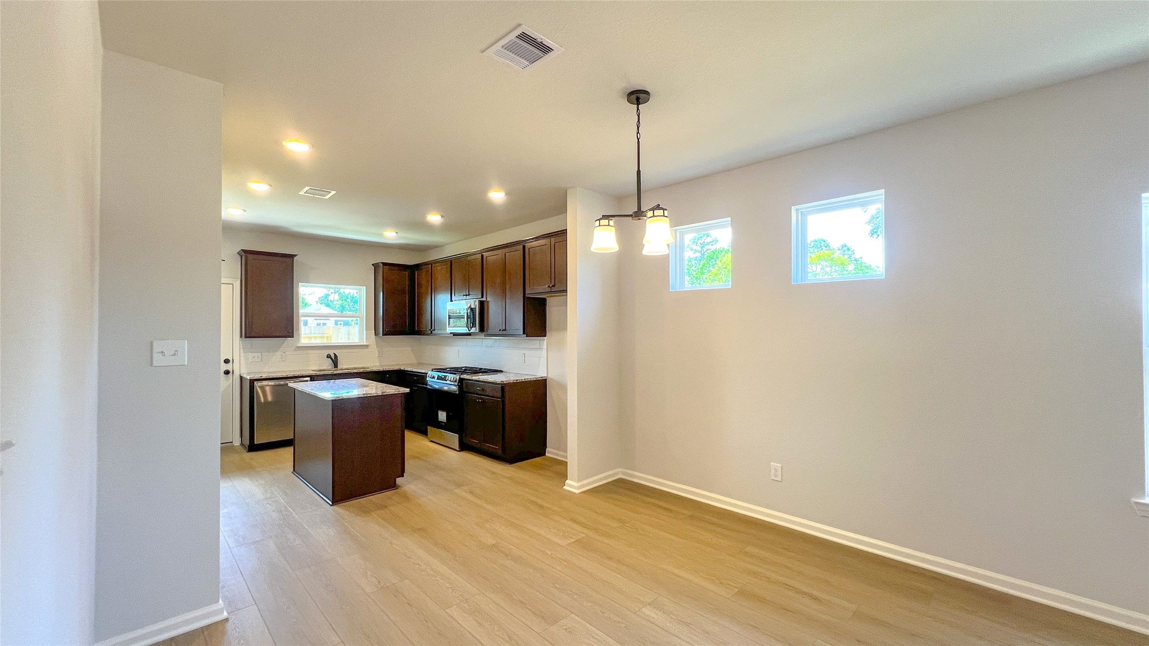 The Blue Jay II- Family Room into Dining and Kitchen