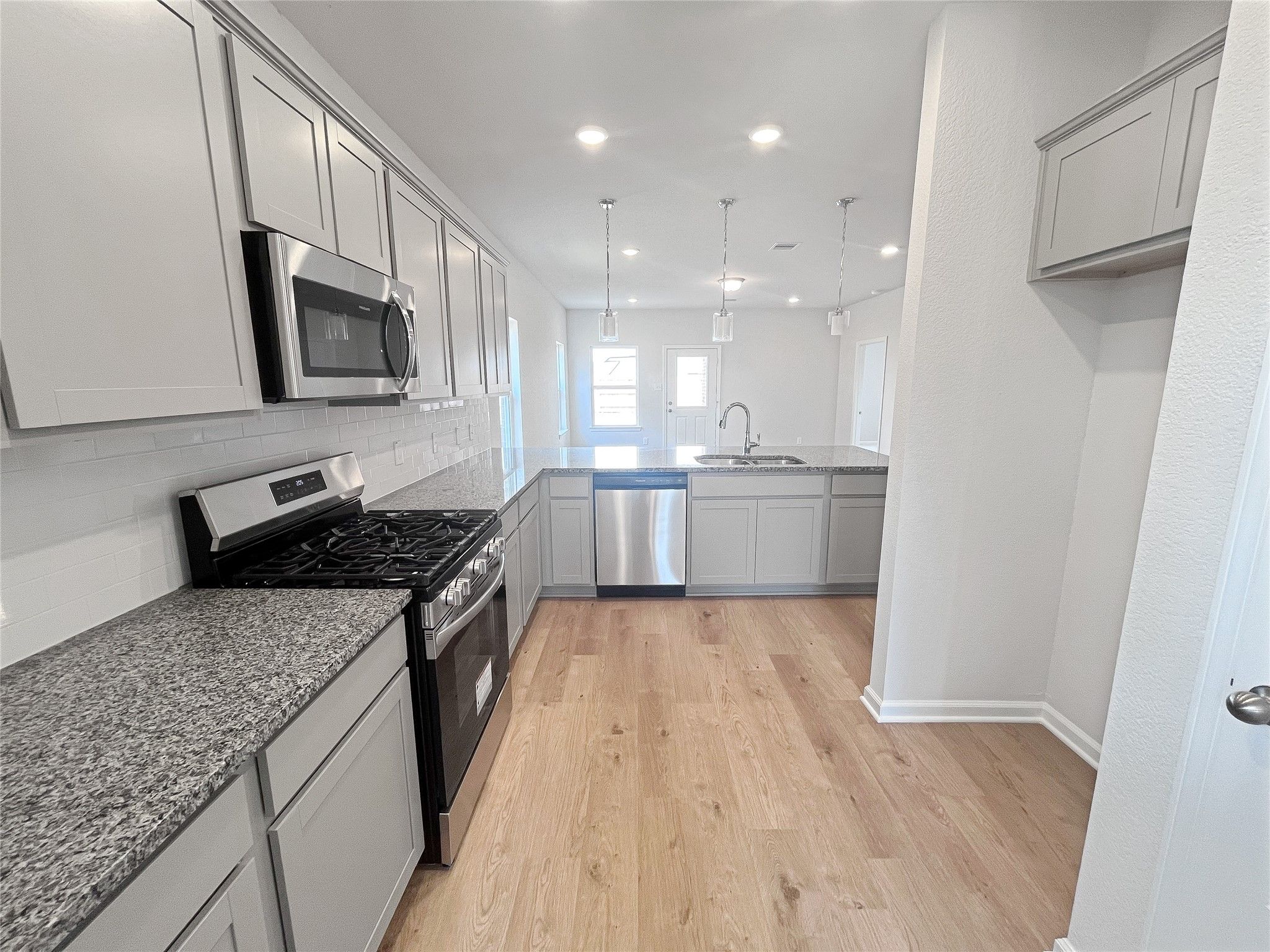 The Caldwell- Kitchen. Sample image for illustration; upgrades, options, and colors may vary.