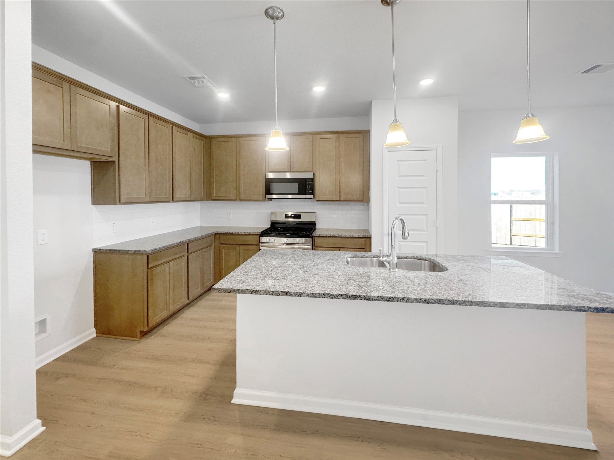 The Waring III- Kitchen. Under construction, options, upgrades and colors will vary.