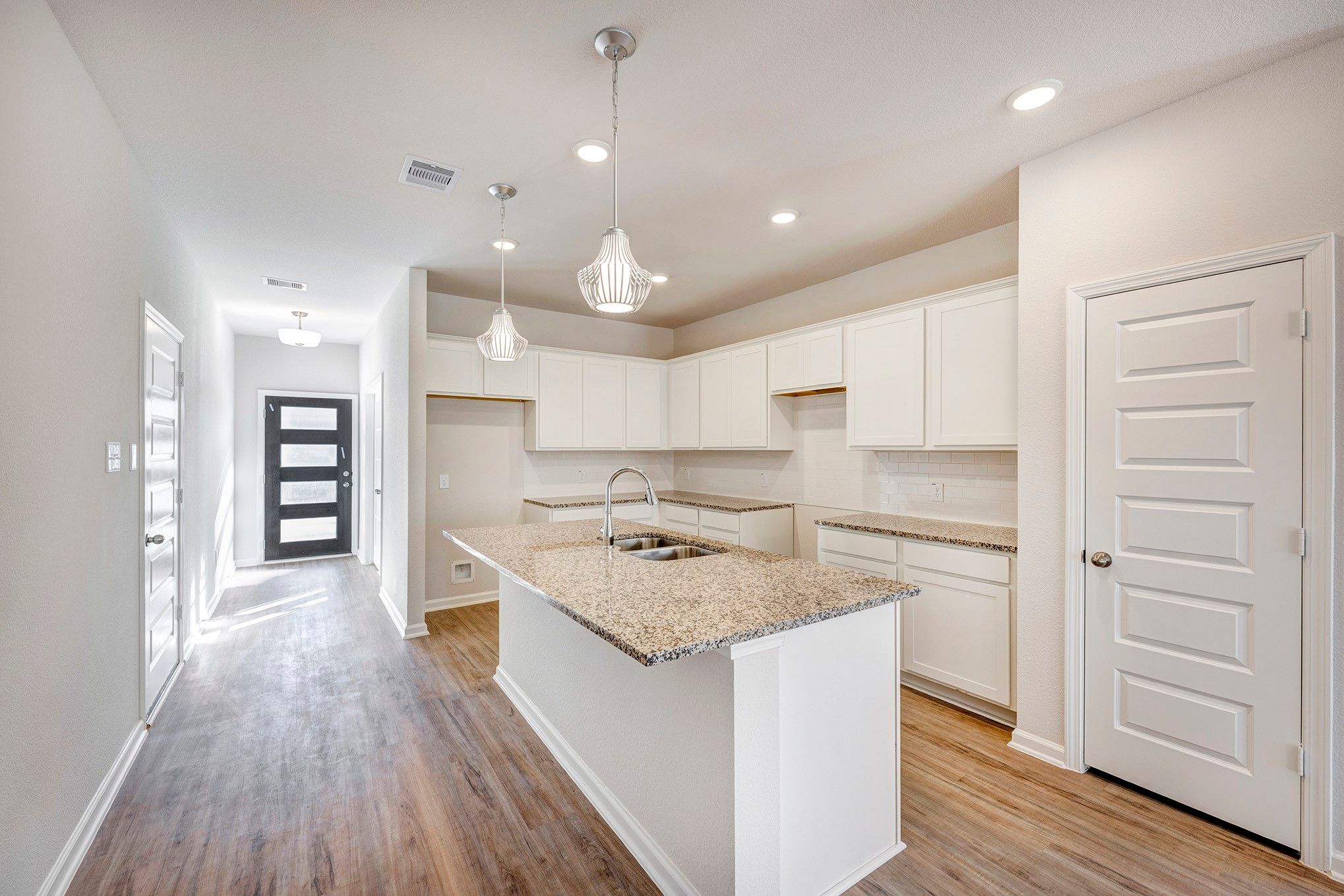 Kitchen and Foyer. Sample image for illustration; upgrades, options, and colors may vary.