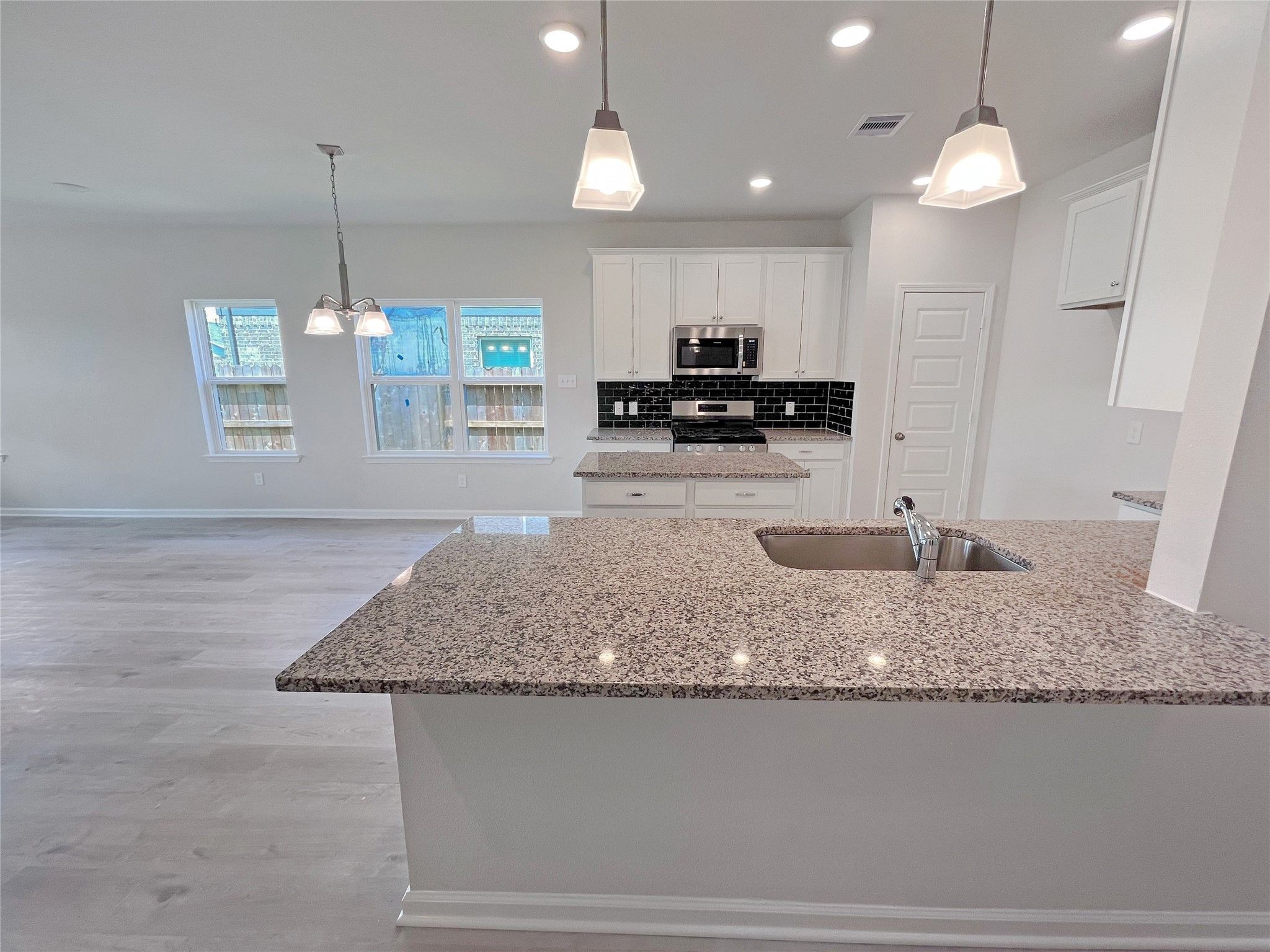 The Georgetown II- Foyer into Kitchen. Sample image for illustration; upgrades, options, and colors