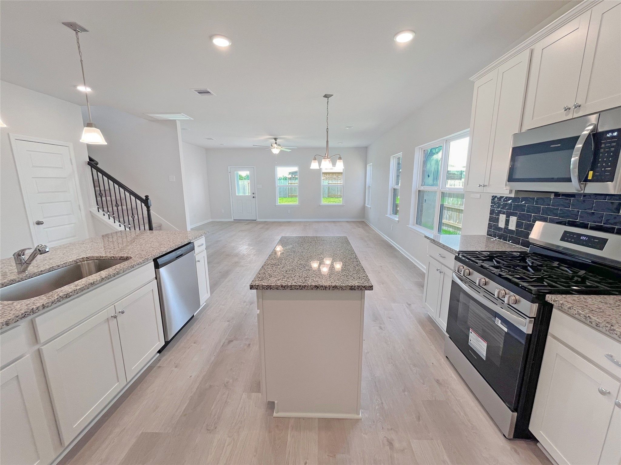 The Georgetown II- Kitchen into Family Room.Sample image for illustration; upgrades, options, and c
