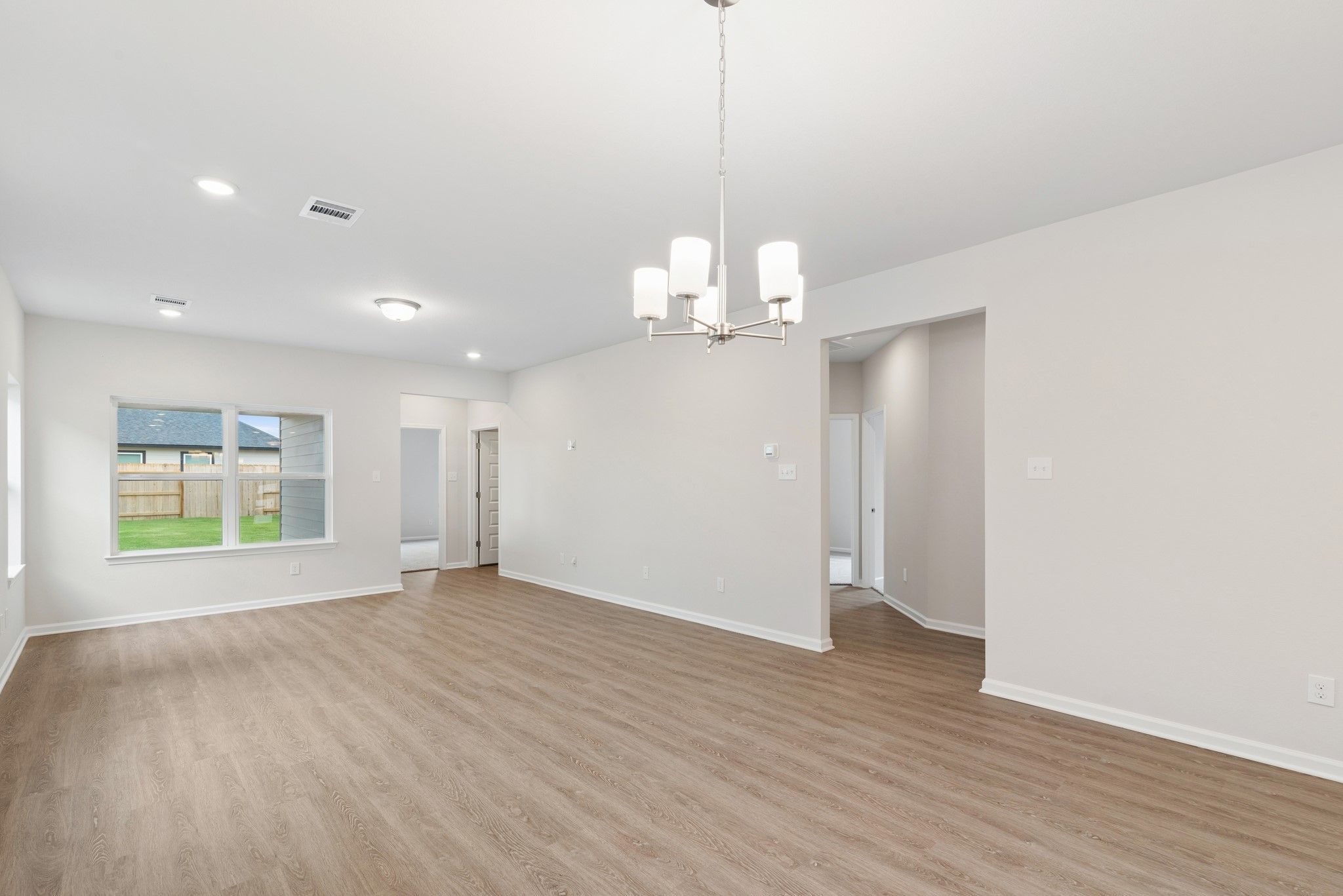 The Oakshire II- Family Room into Secondary Bedrooms Hallway.  Sample image for illustration; upgra
