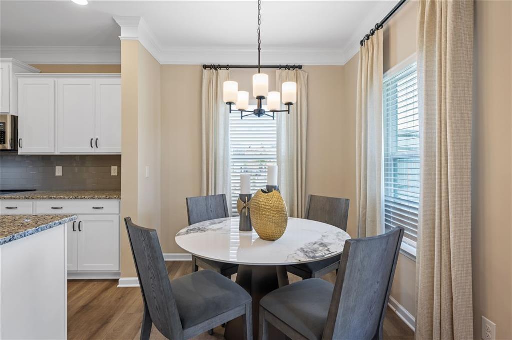 White shaker-style cabinetry with dark hardware