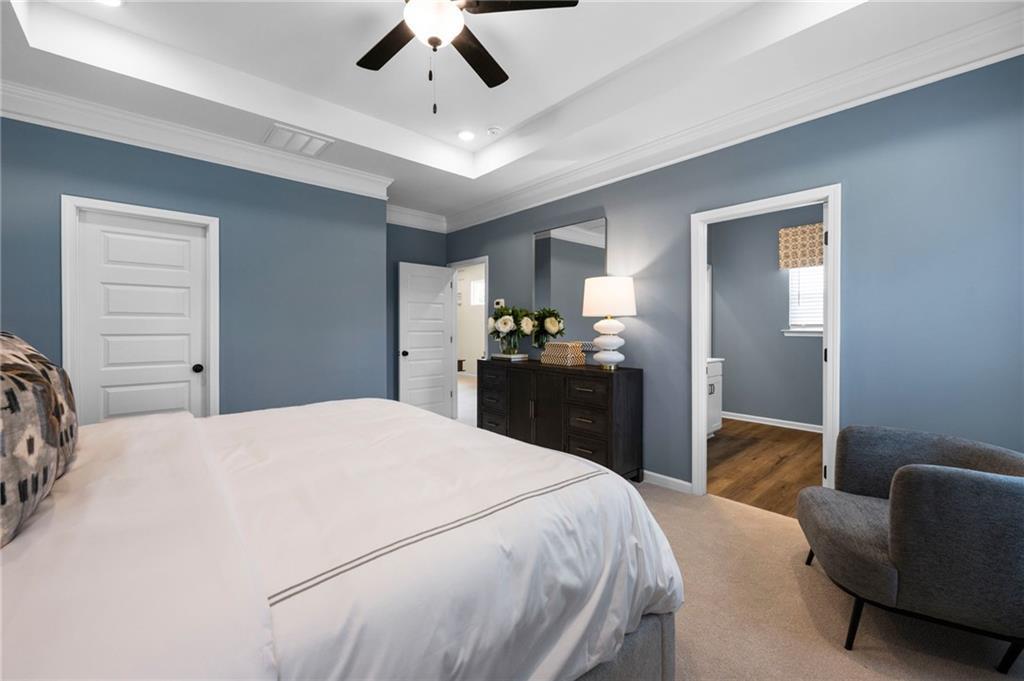 Tray ceiling with recessed lighting and crown molding