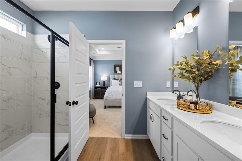 Dual vanity with white cabinetry and integrated sinks