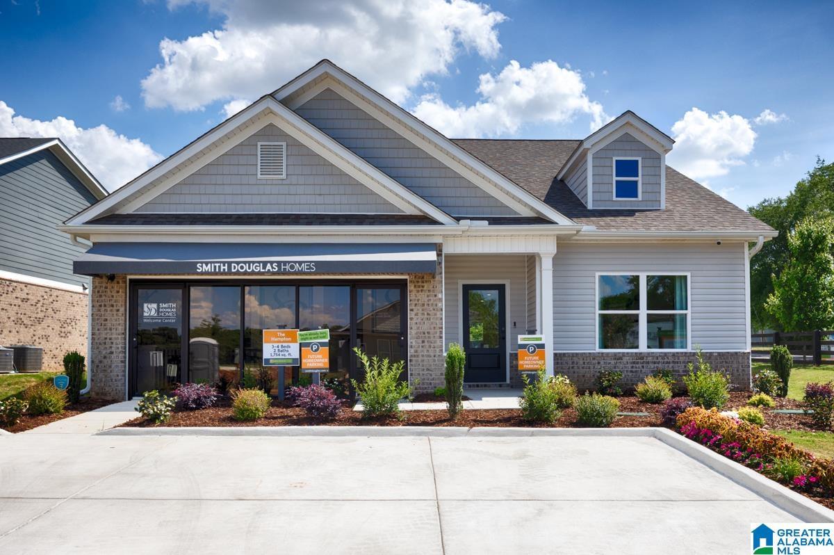 Siding and brick exterior with a prominent front entrance