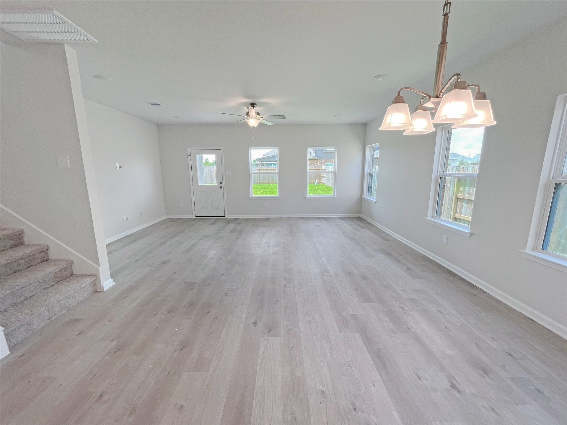The Georgetown II- Dining into Family Room. Sample image for illustration; upgrades, options, and colors may vary.