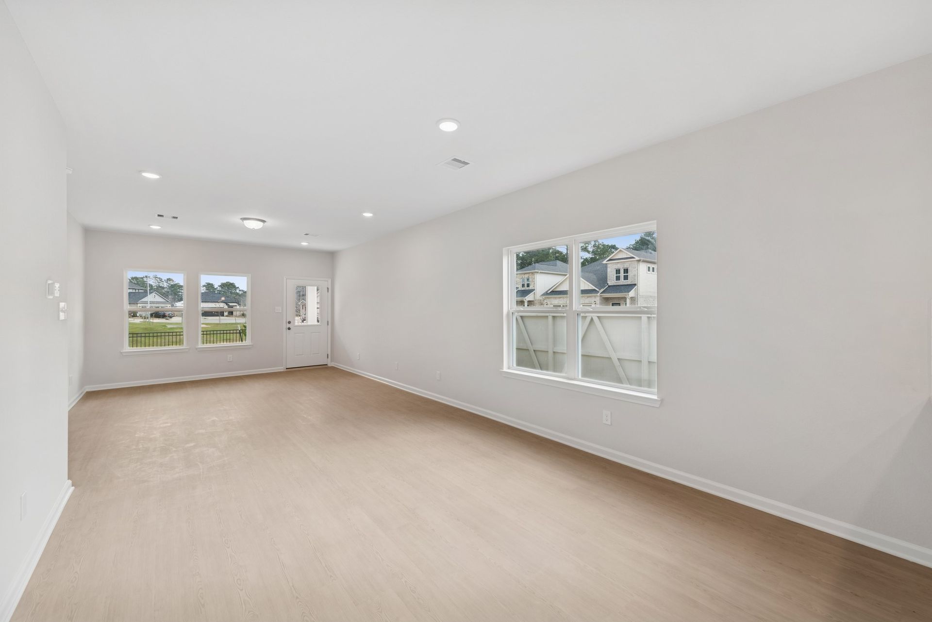 The Cardinal II- Dining Area into Family Room. Photos of home shown are for illustration only; actual features, colors, and upgrades may vary.