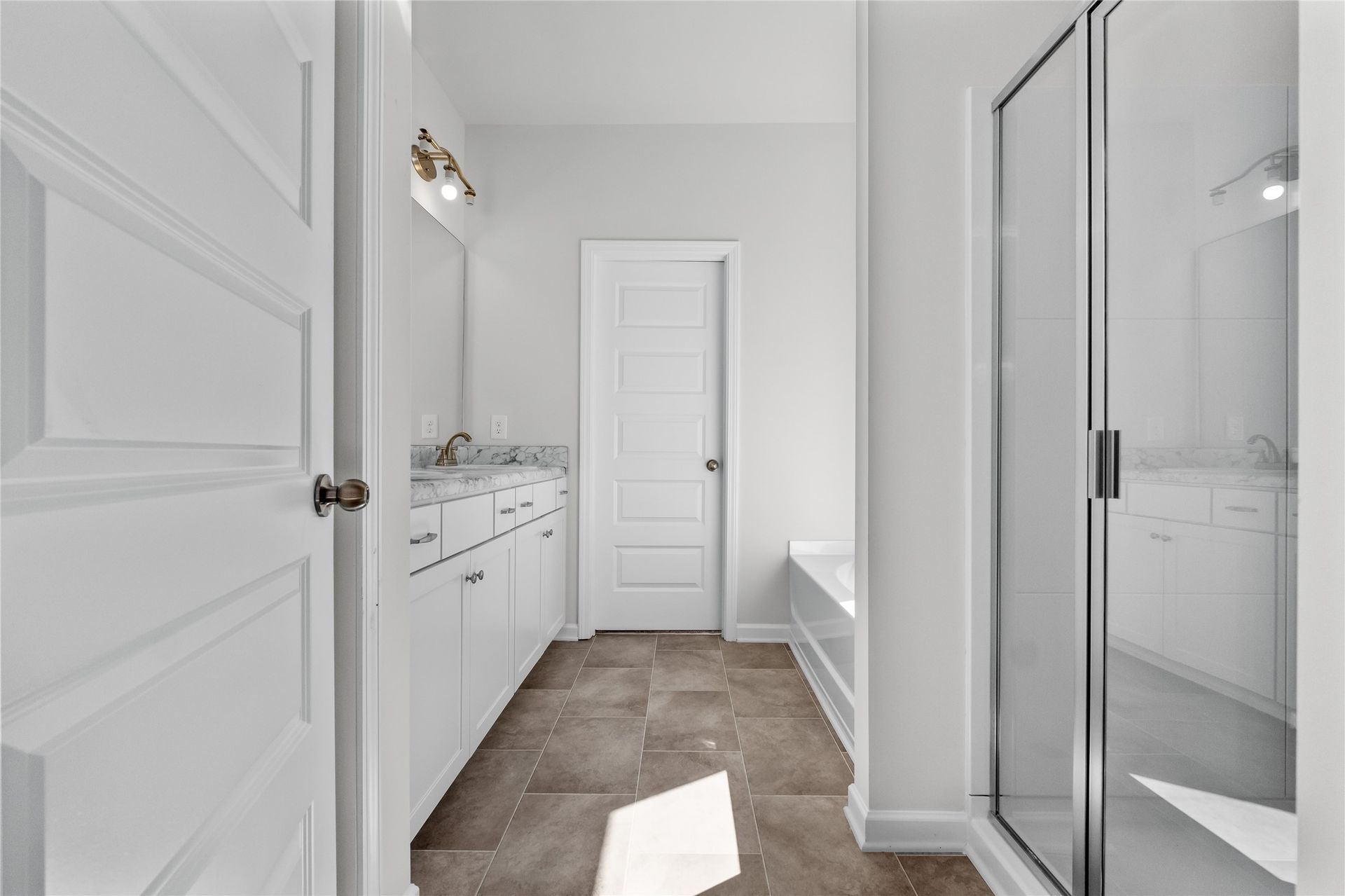 The Coleman- Primary Bathroom with Separate Tub and Shower. Home under construction, photo used for illustrative purposes only, colors and options will vary.
