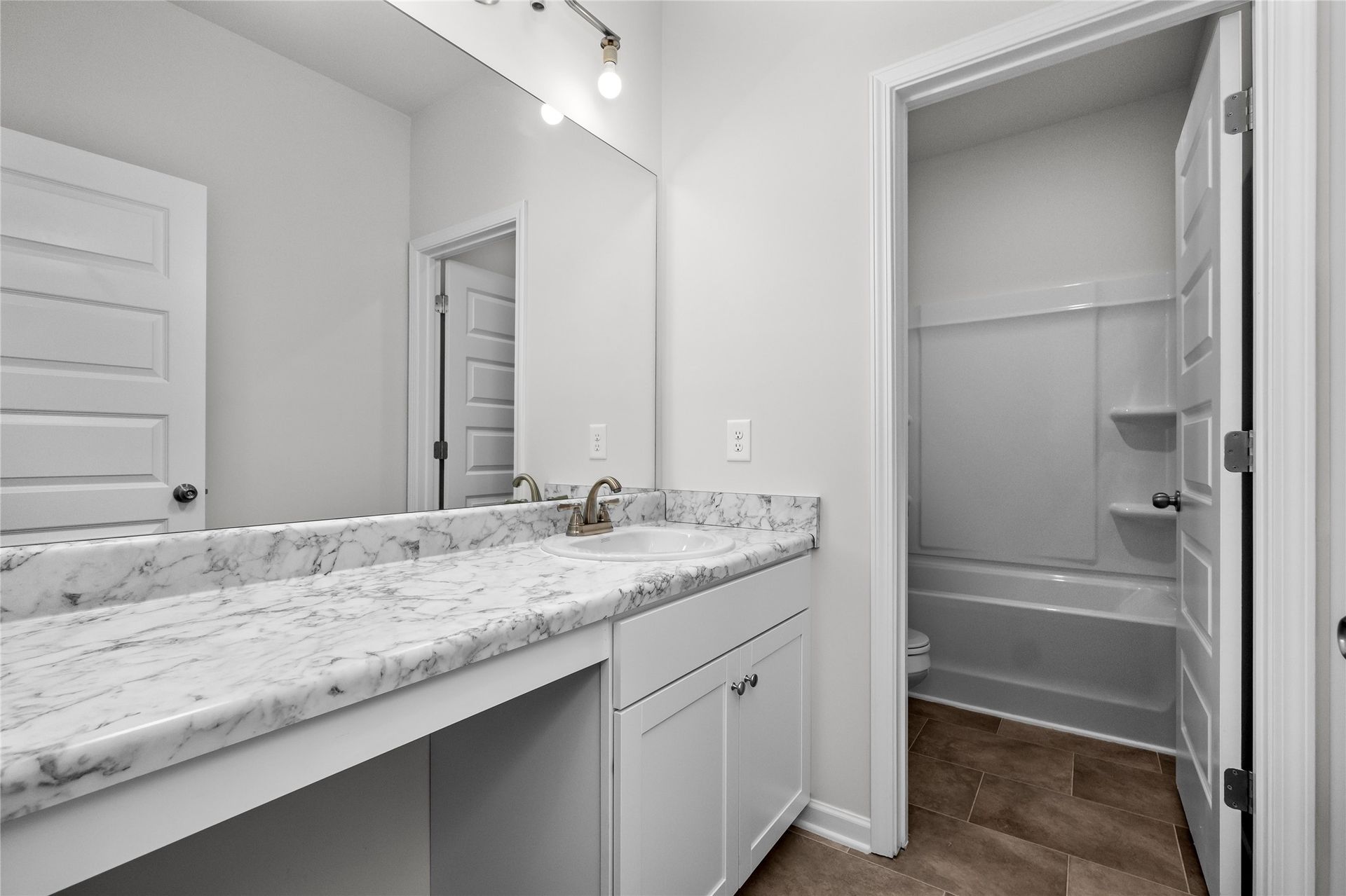 The Coleman- Hall Bath. Home under construction, photo used for illustrative purposes only, colors and options will vary.