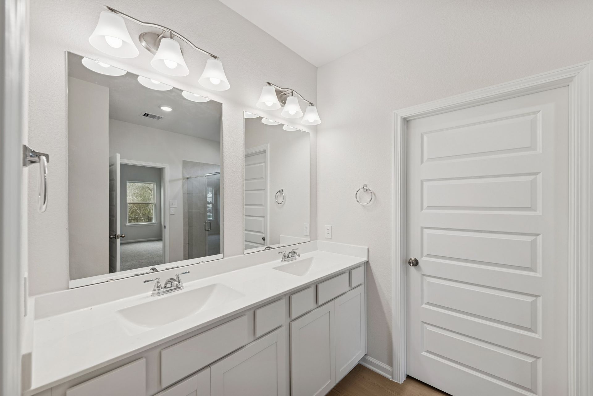 The Cardinal II- Primary Bathroom with Dual Vanities. Photos of home shown are for illustration only; actual features, colors, and upgrades may vary.