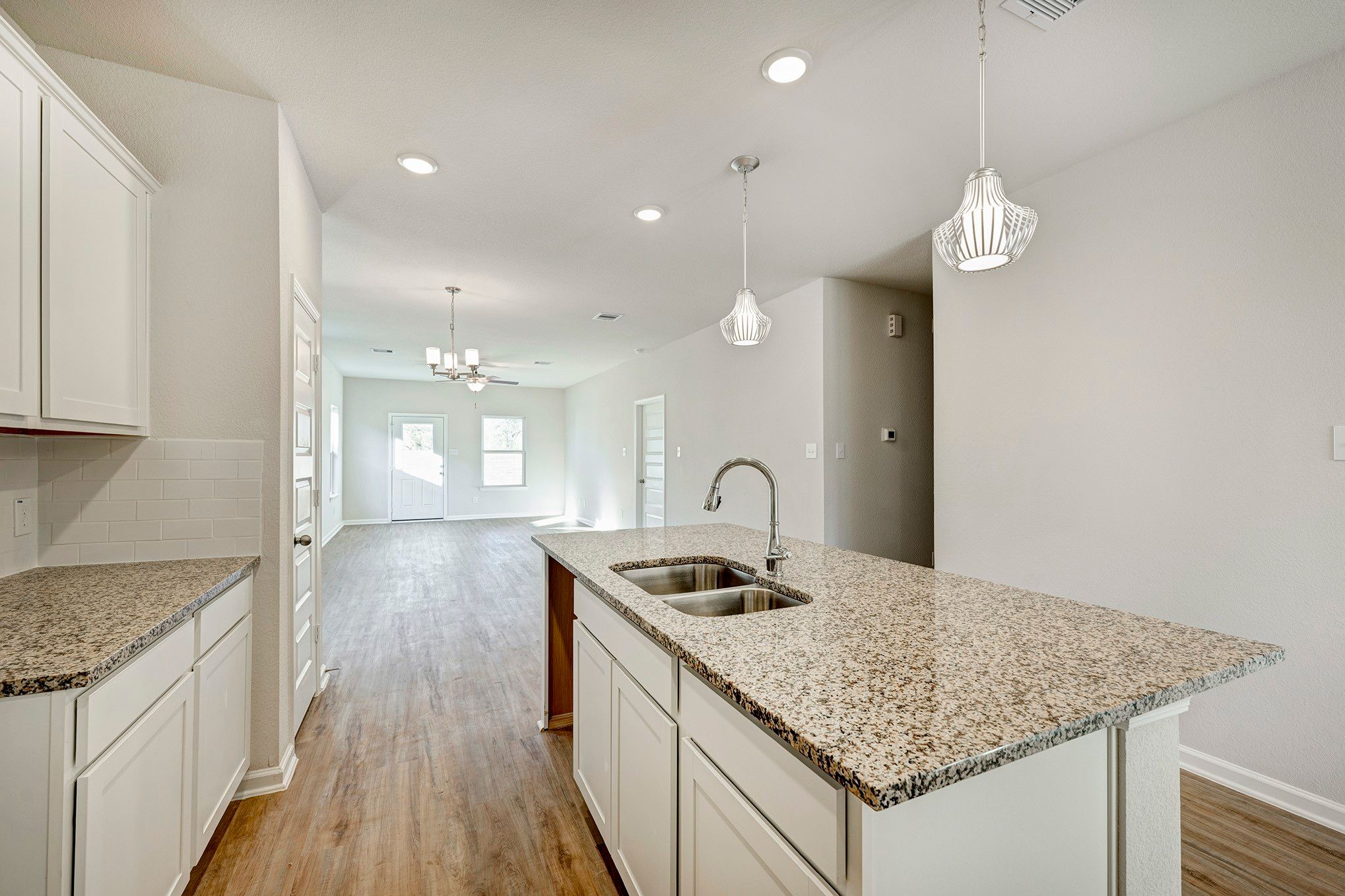 Kitchen into Family Room. Sample image for illustration; upgrades, options, and colors may vary.