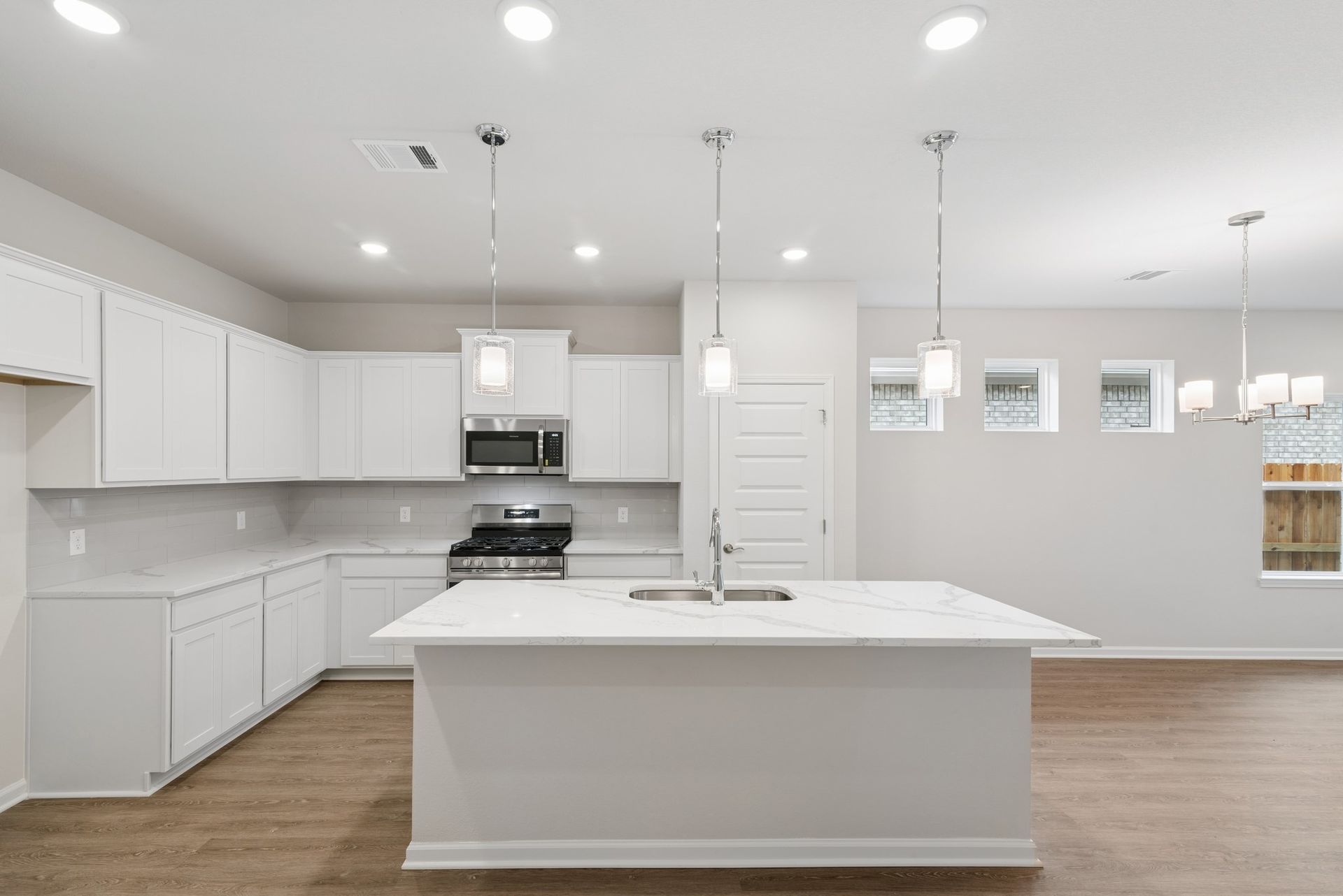 The Oakshire II- Kitchen with Island. Sample image for illustration; upgrades, options, and colors may vary.