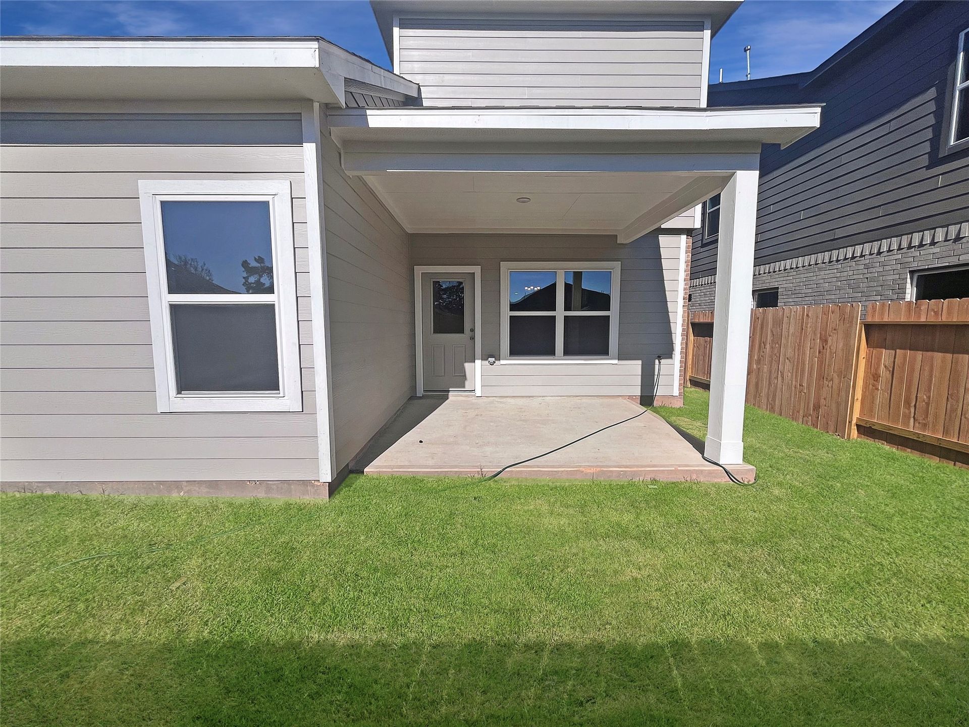The Robin II- Rear Covered Patio. Sample image to be used for example only, colors, options and upgrades vary.