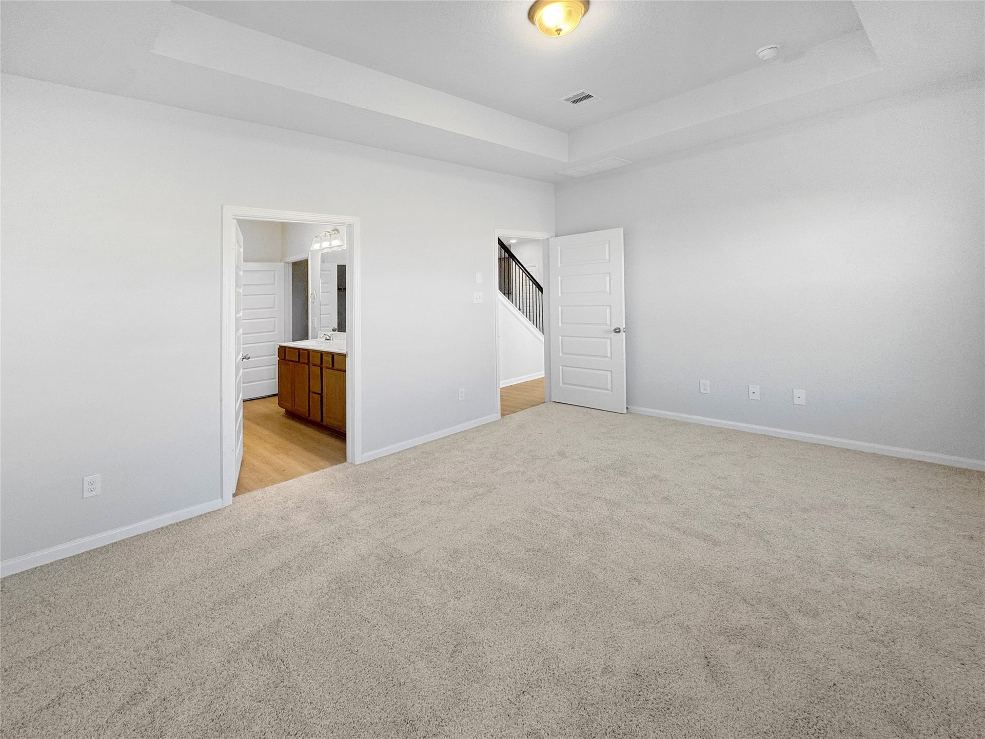 The Waring III-Primary Suite, Tray Ceiling not included. Under construction, options, upgrades and colors will vary.