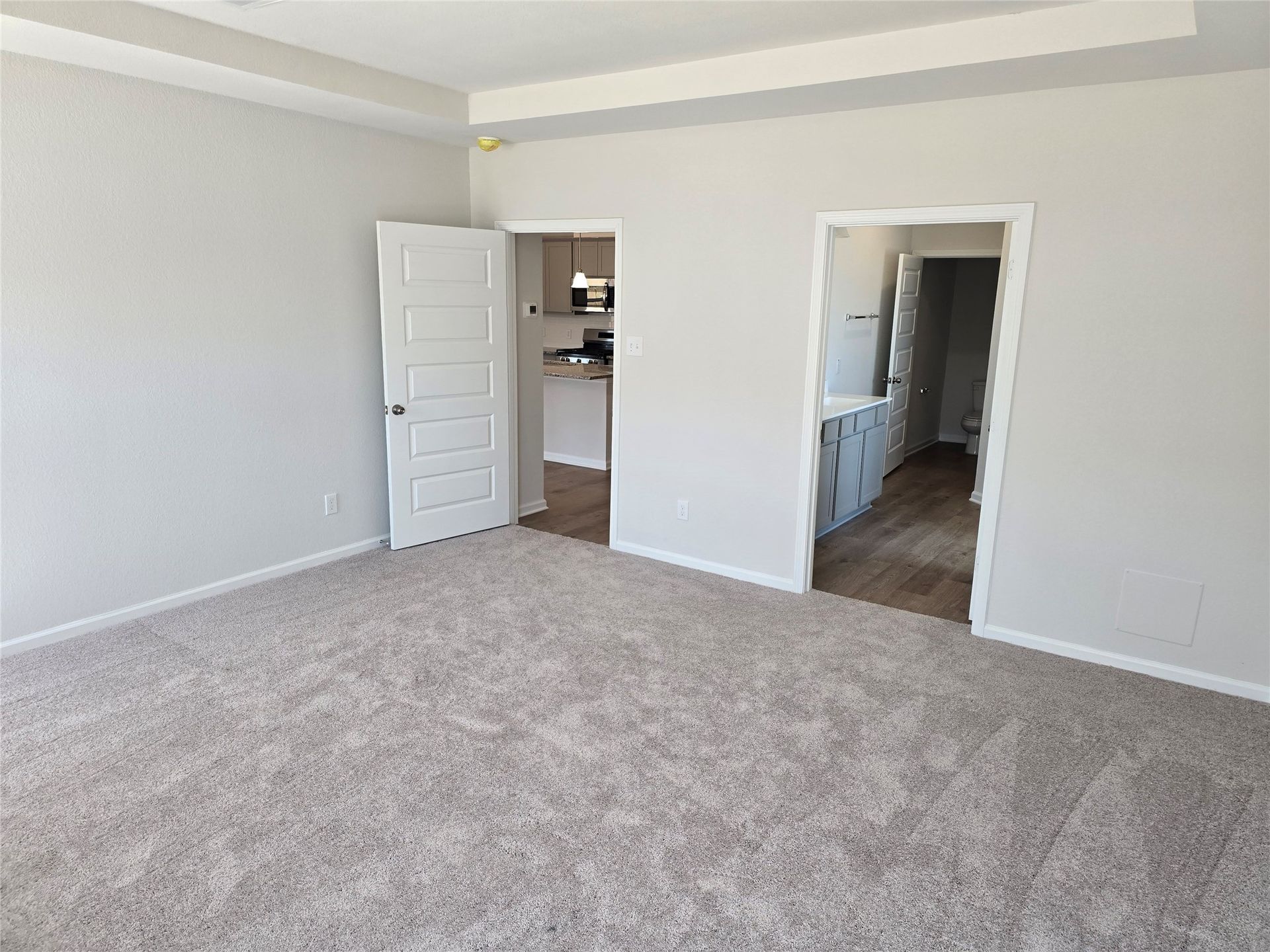 The Shetland III- Primary Suite, Tray Ceiling not Included. Home under construction, photo used for illustrative purposes only, colors and options will vary.