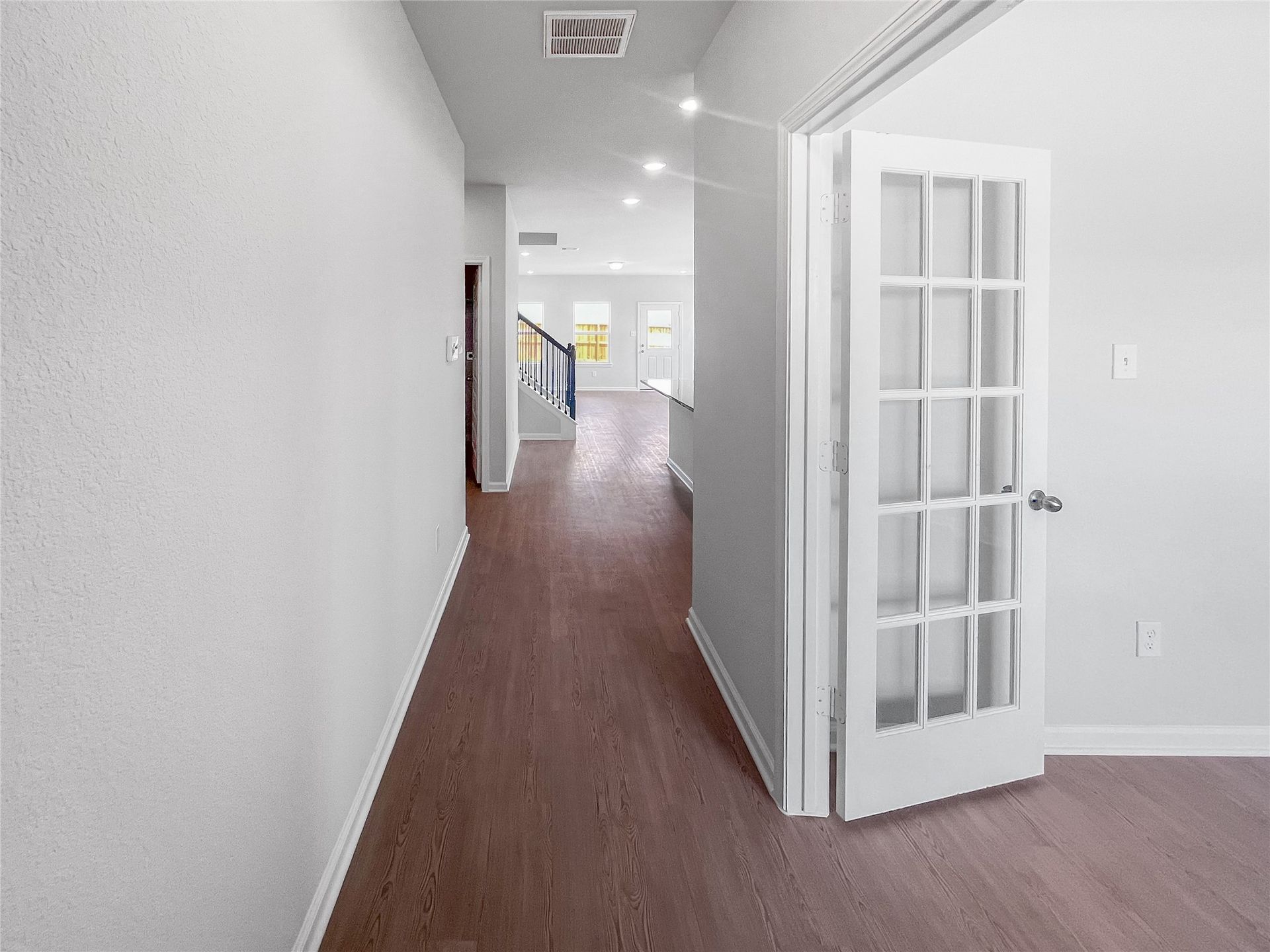 The Waring III- Foyer into Study with French doors. Sample image for illustration; upgrades, options, and colors may vary.