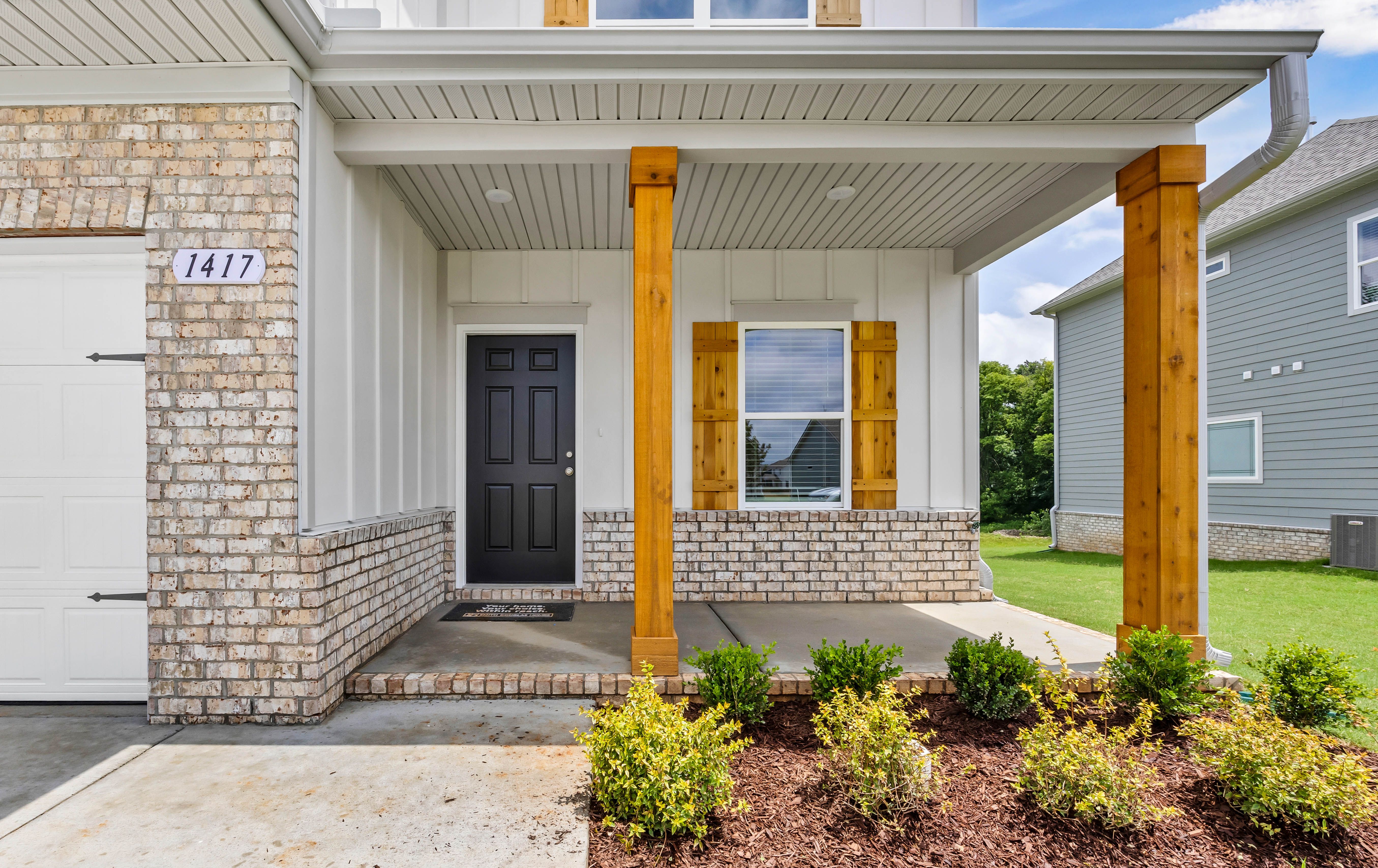 Welcoming Entrances with Cedar Accents