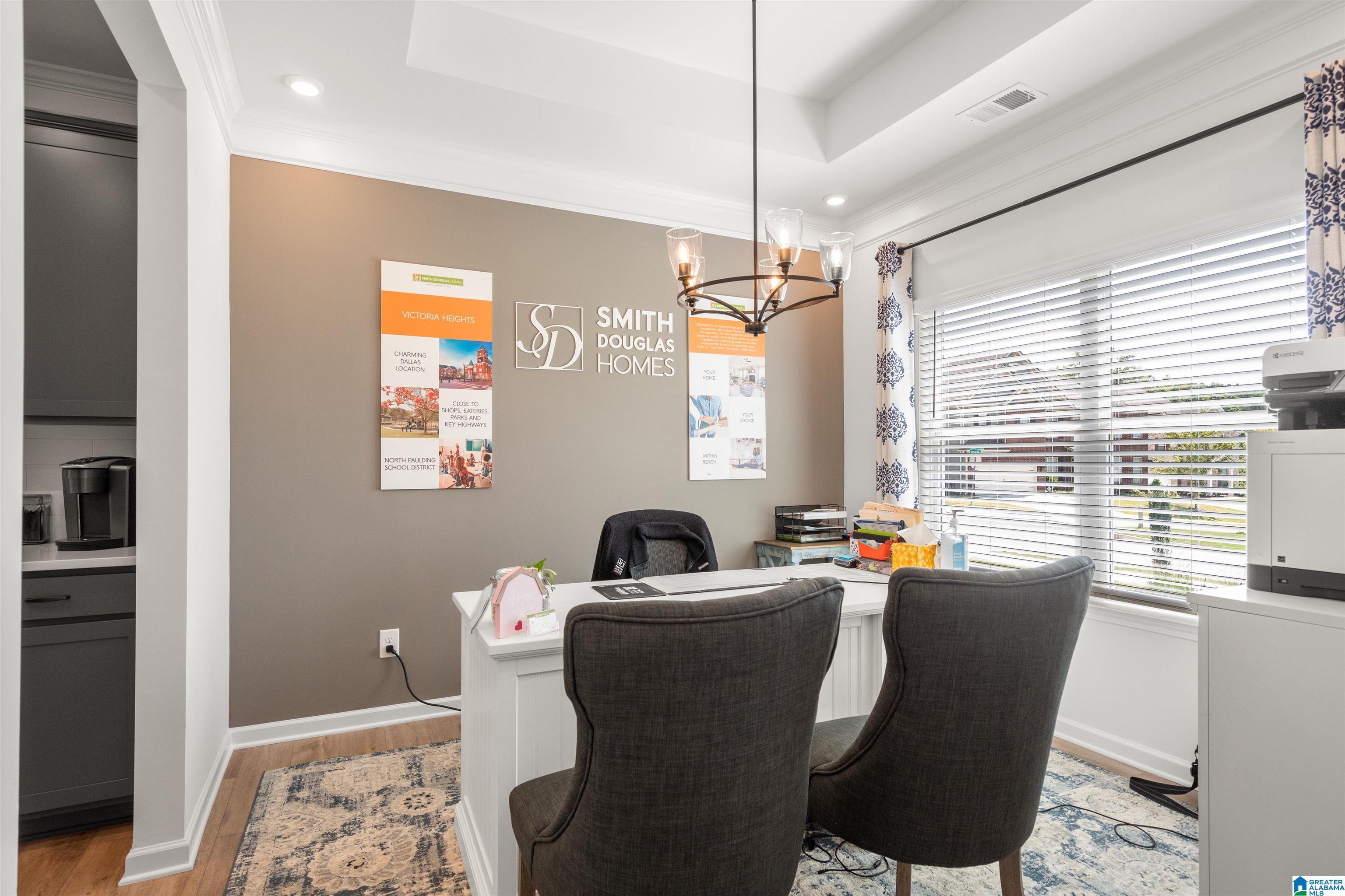 Recessed lighting, crown molding, a tray ceiling, and wood-finish flooring