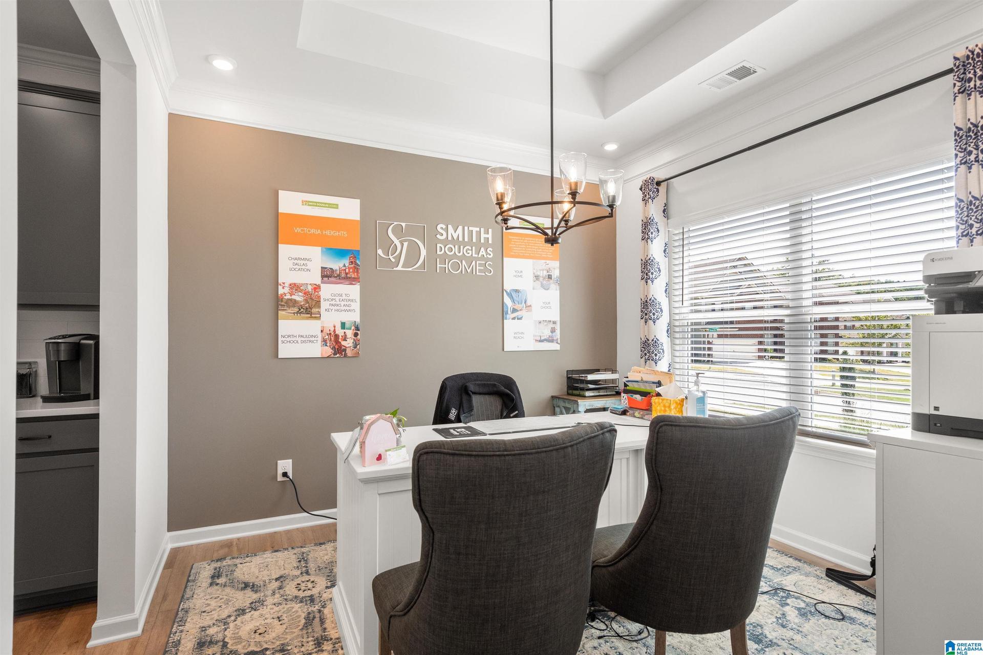 Recessed lighting, crown molding, a tray ceiling, and wood-finish flooring