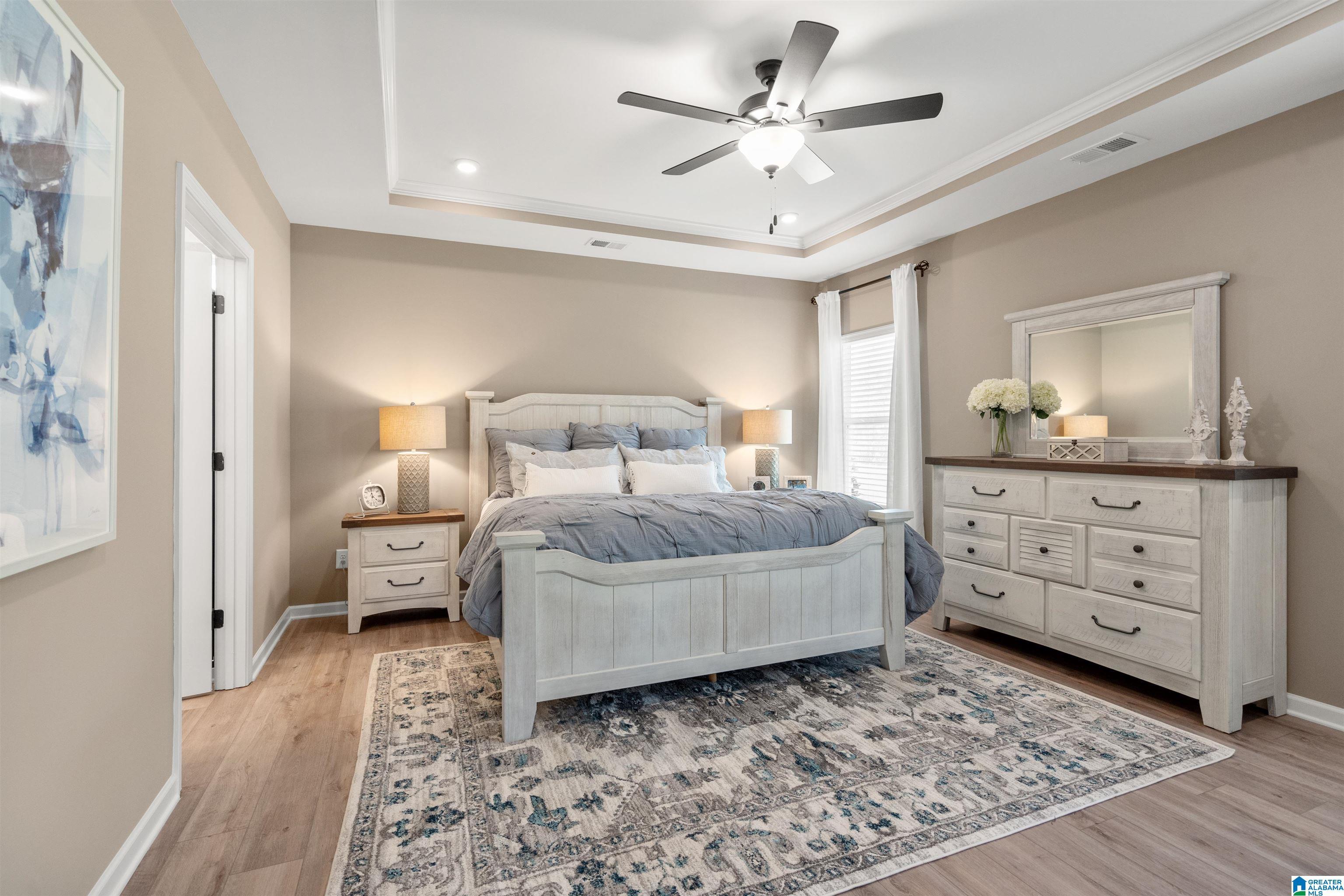 Tray ceiling with recessed lighting and crown molding