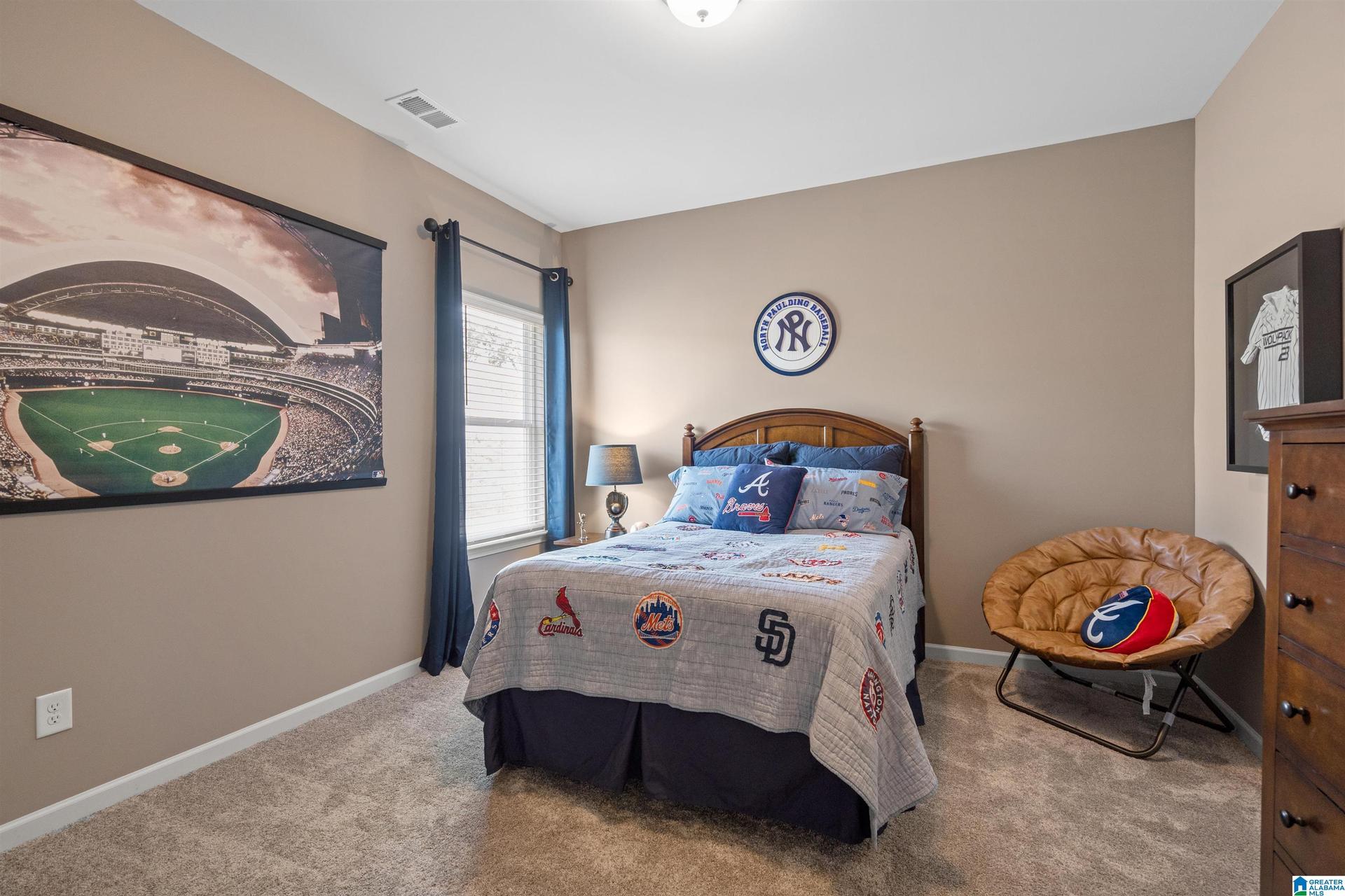 Recessed lighting, neutral wall tones, and carpeted flooring