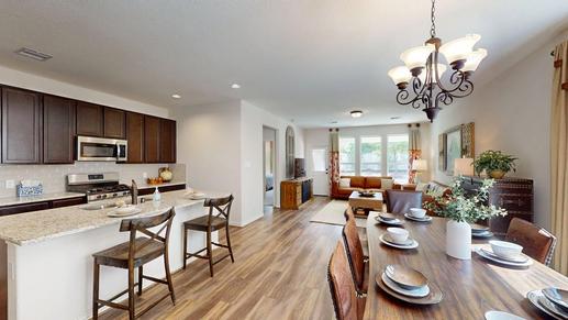 The Robin- Dining Area into Family Room and Kitchen