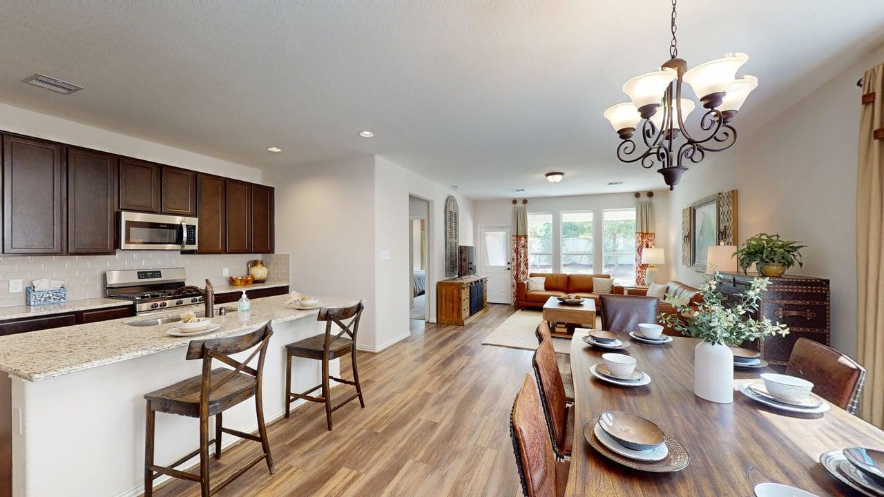 The Robin- Dining Area into Family Room and Kitchen