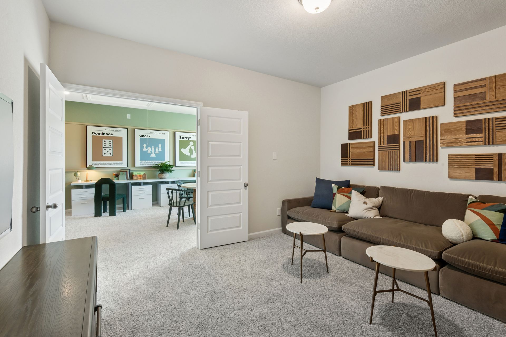 The Princeton II- Media Room into the Loft/Game Room