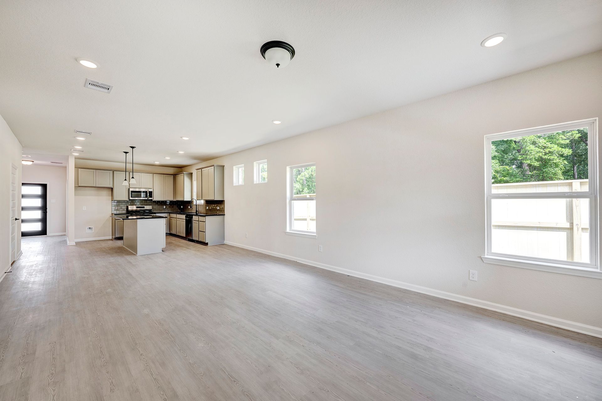 The Davenport II- Family Room into Dining Area and Kitchen