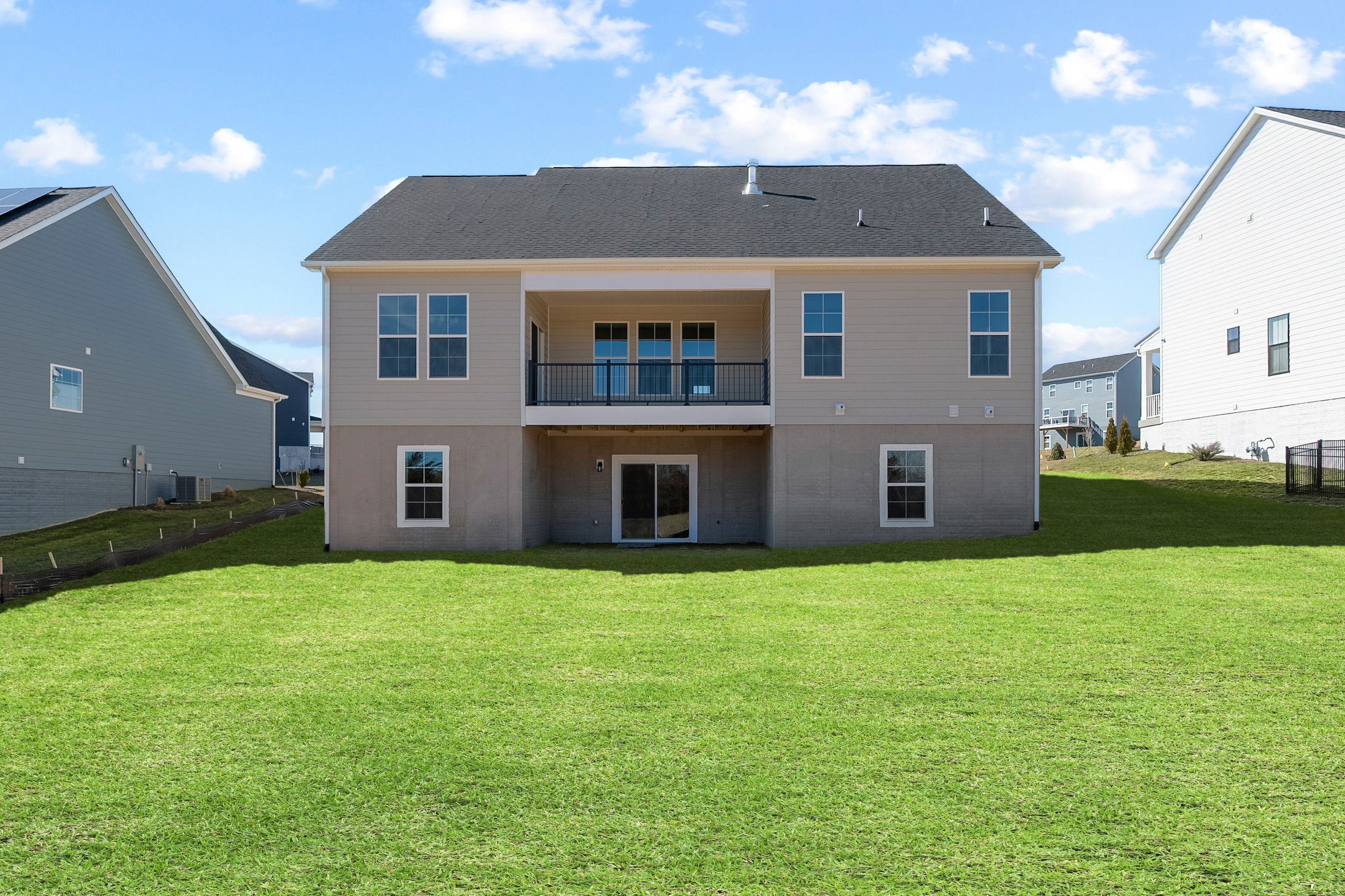 Rear Facade, Covered Back Porch, & Walk Out Lower Level