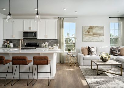 Kitchen and great room with laminate wood flooring