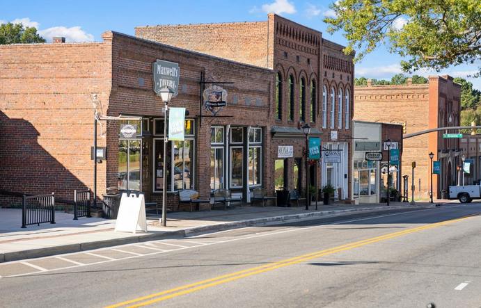 Home to Waxhaw Candle Company, Provisions Waxhaw, Waxhaw Antique Mart, Iris and Poppy Gift and Dress