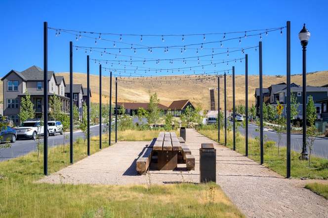 A linear park with built-in outdoorsy-styled hangout spots.