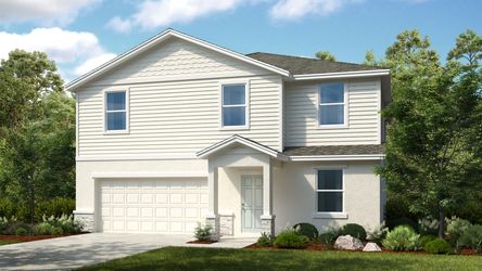 New construction home in Waterstone, Groveland, Florida, surrounded by bright landscaping