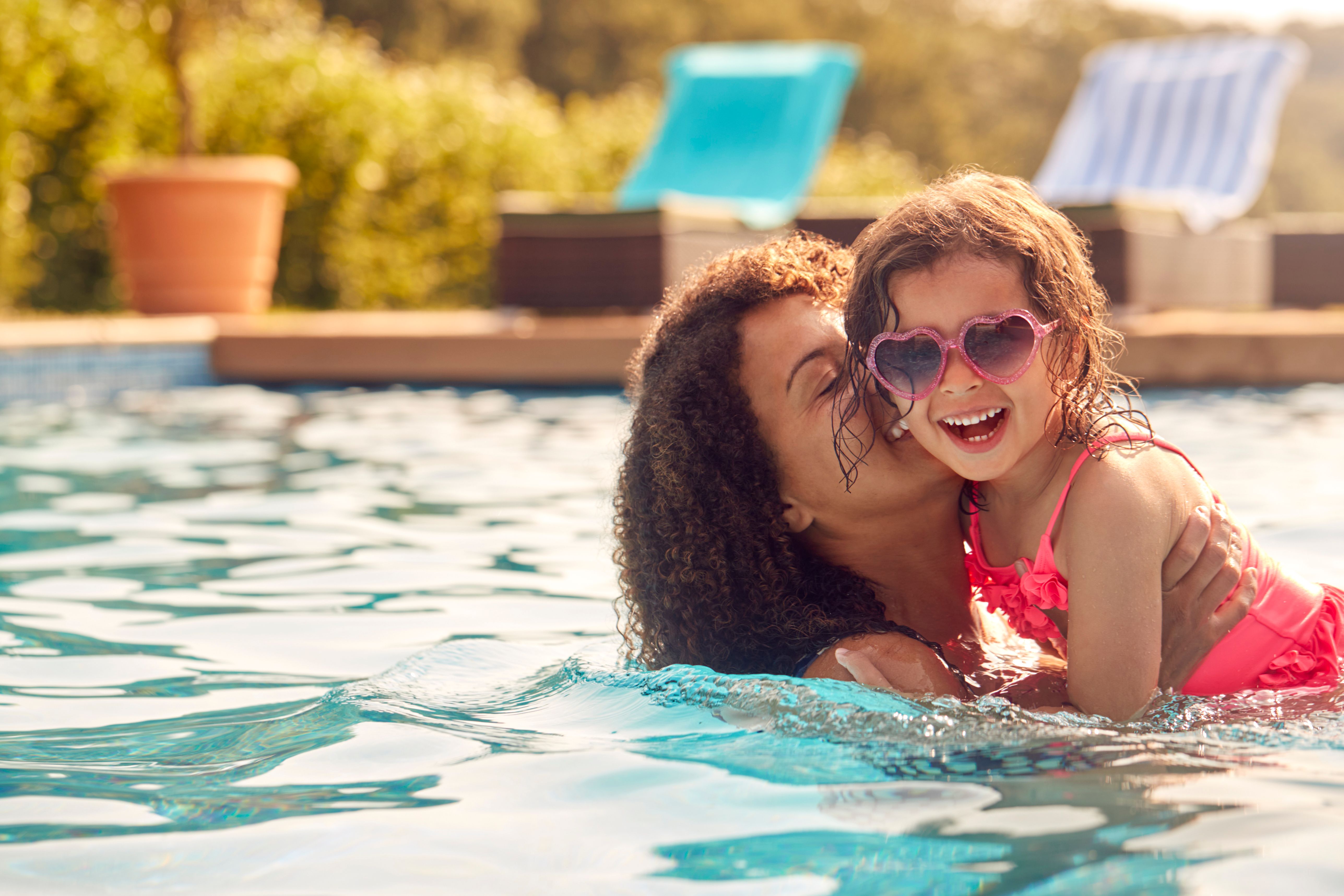 mother and daughter in pool