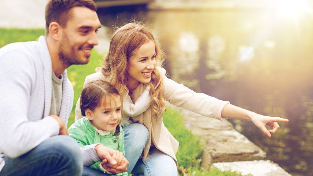young family near pond