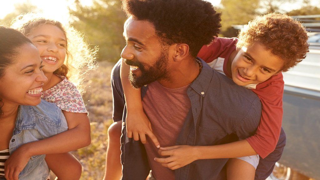 mom and dad with 2 kids