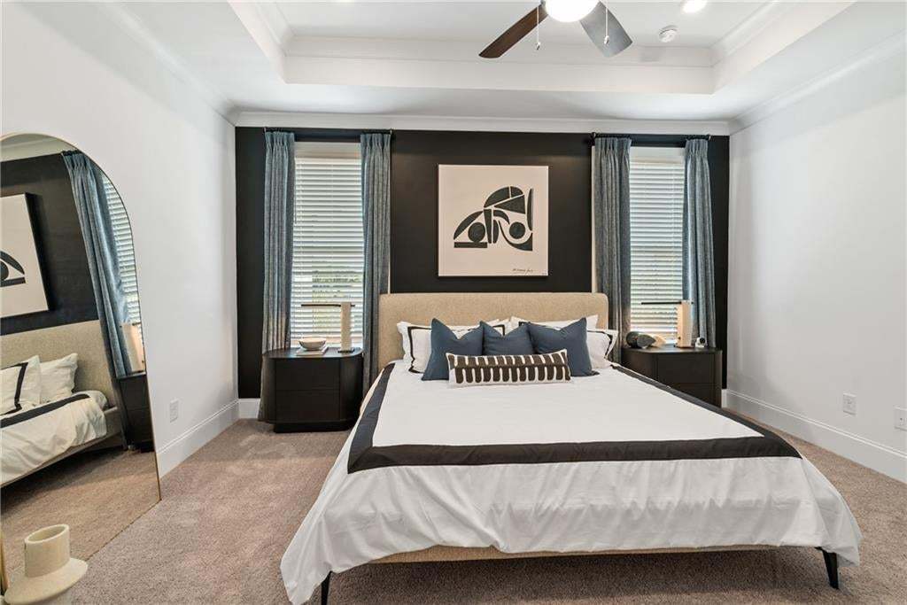 Owner's suite designed for comfort and relaxation with thoughtful finishes throughout. *Photos are not the actual unit, but of the same floor plan and decorated model home.
