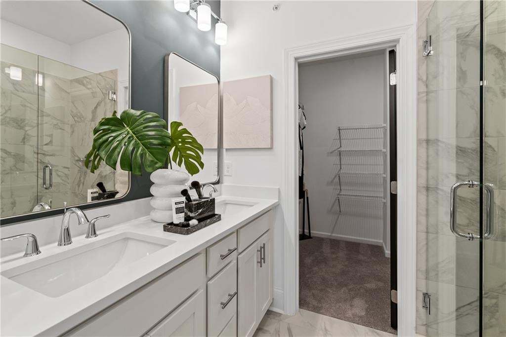 Primary ensuite bath offers a spa-like retreat, perfect for relaxing. *Photos are not the actual unit, but of the same floor plan and decorated model home.