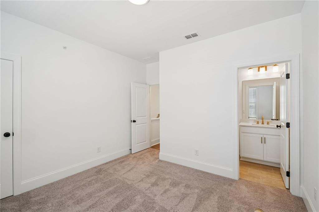 Secondary bedroom with ensuite bathroom.
