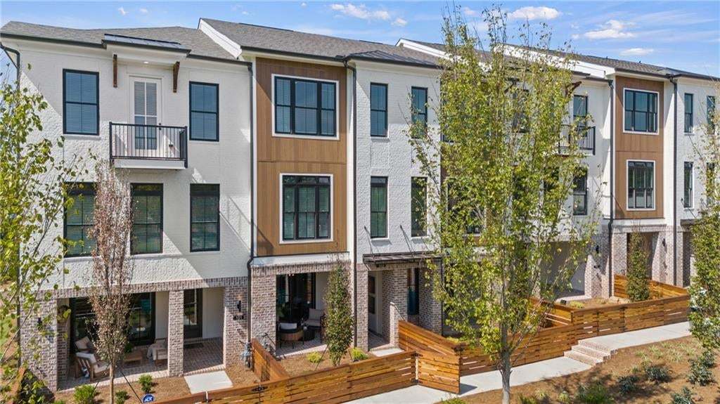 Front Entry Covered Terrace , Main Entry with a sliding glass door . Not the actual building or unit .