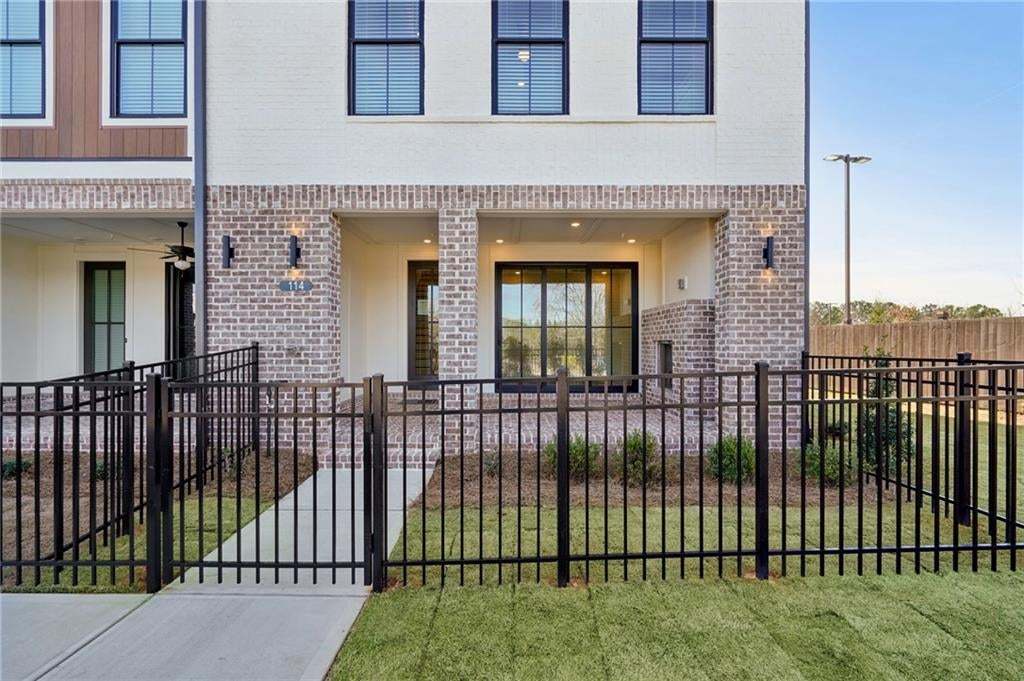 Front entry with fenced in yard, fully maintained by the HOA.