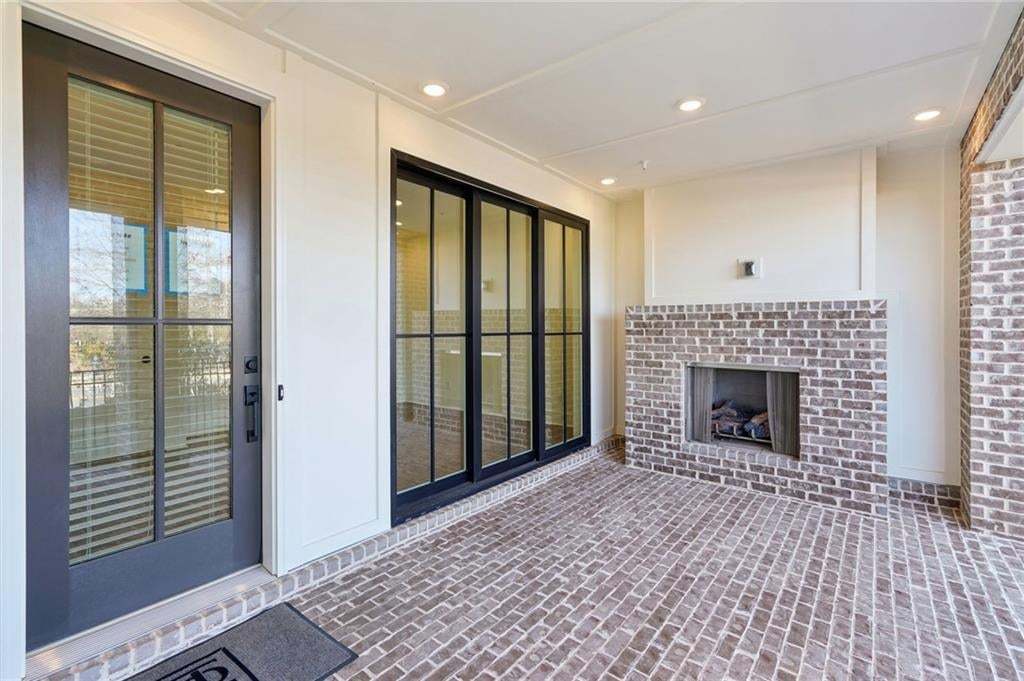 Covered patio with gas fireplace. Wired to hang TV above!