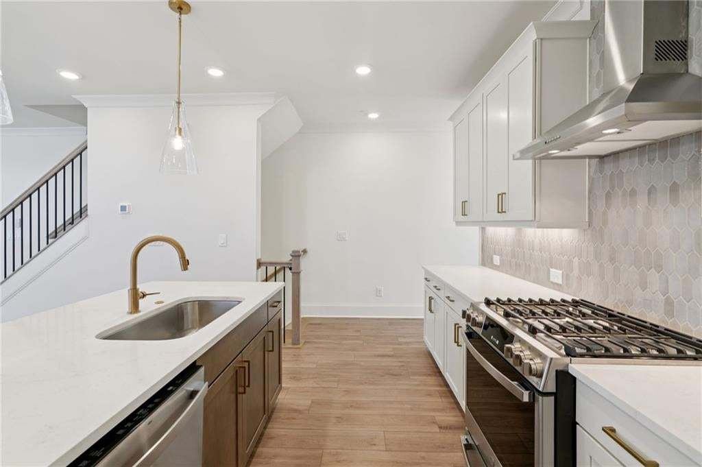 Kitchen features include two tones Cabinetry and Quartz Countertops.