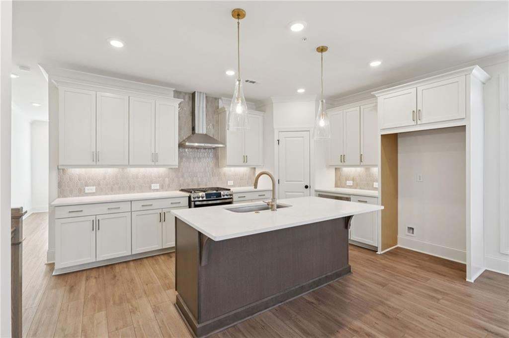 Spacious kitchen with plenty of cabinet space and walk-in pantry.