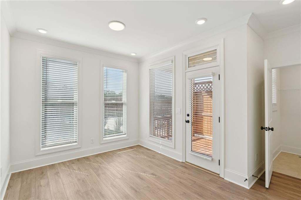 Sunroom with private covered deck. Can also be used as a home office.