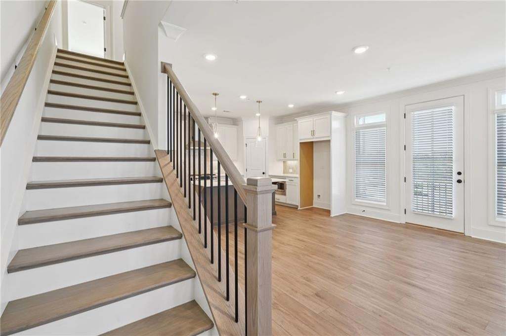 Stairs on second level, leads to 3 bedrooms on third floor.